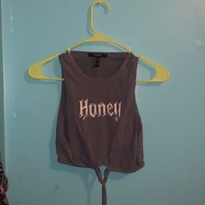 This is a tank top with open sides and has “honey” written on